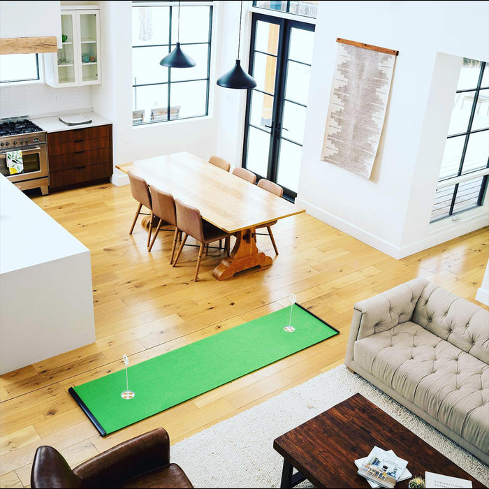 Putting green inside a homeowner's open concept living space