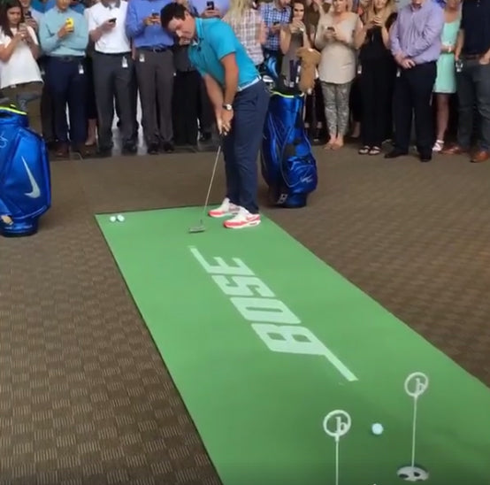 Rory McIlroy practices putting on a customized BirdieBall putting green