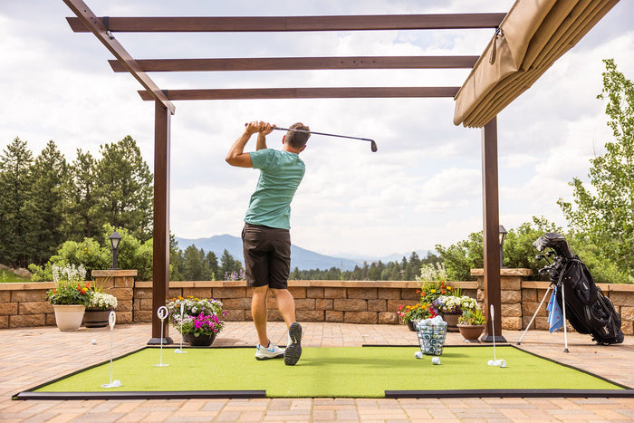 Practicing golf in your backyard with BirdieBalls and a golf hitting turf