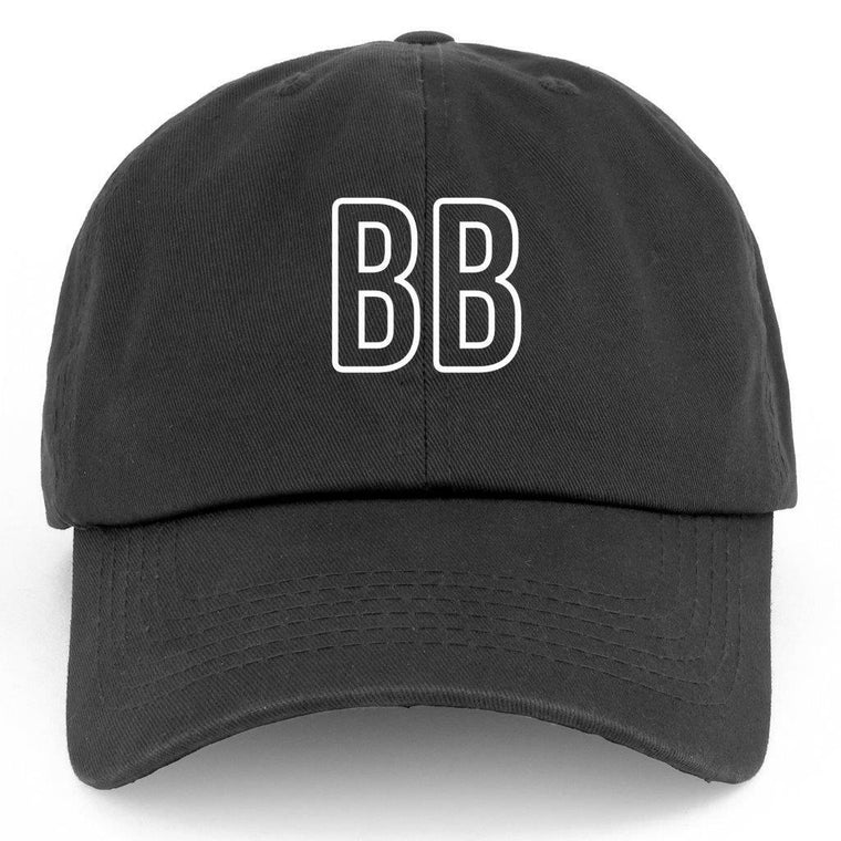 The BirdieBall Hat (Black BB) by BirdieBall features white "BB" embroidery on the front and an adjustable back strap for comfort.