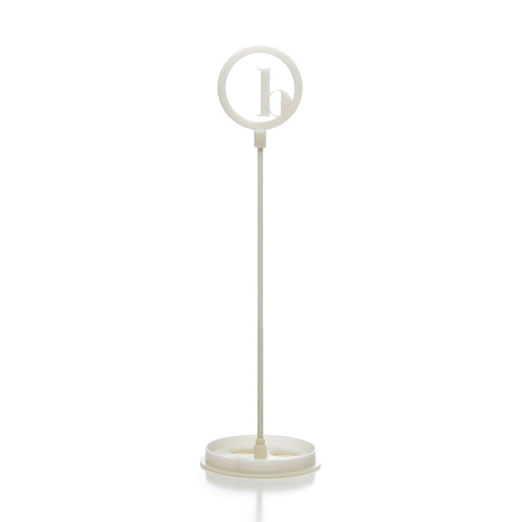The BirdieBall Putting Green Cups and Flags (Options Available) features a white plastic stand with a round frame holding a lowercase "b," making it an ideal accessory or replacement for your BirdieBall putting green.